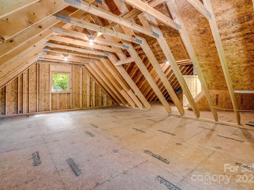 216 Log Gap Road, Fairview, NC 28730.  MLS# CAR4221522, YatesRealty ID 18479. 800+ Sq Ft of unfinished storage space - Upper Level