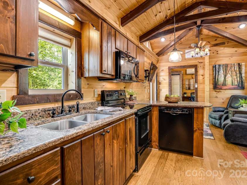 216 Log Gap Road, Fairview, NC 28730.  MLS# CAR4221522, YatesRealty ID 18479. Bright Kitchen, Plentiful Storage