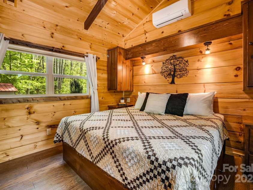 216 Log Gap Road, Fairview, NC 28730.  MLS# CAR4221522, YatesRealty ID 18479. Primary Bedroom - Built in Bed and Storage