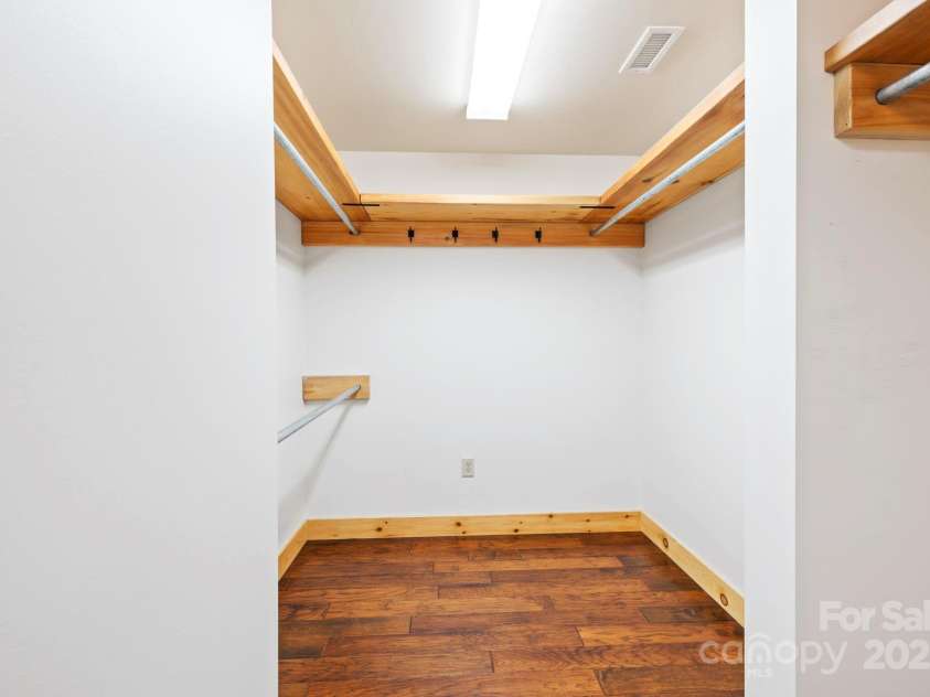 216 Log Gap Road, Fairview, NC 28730.  MLS# CAR4221522, YatesRealty ID 18479. Primary Suite Walk-In Closet