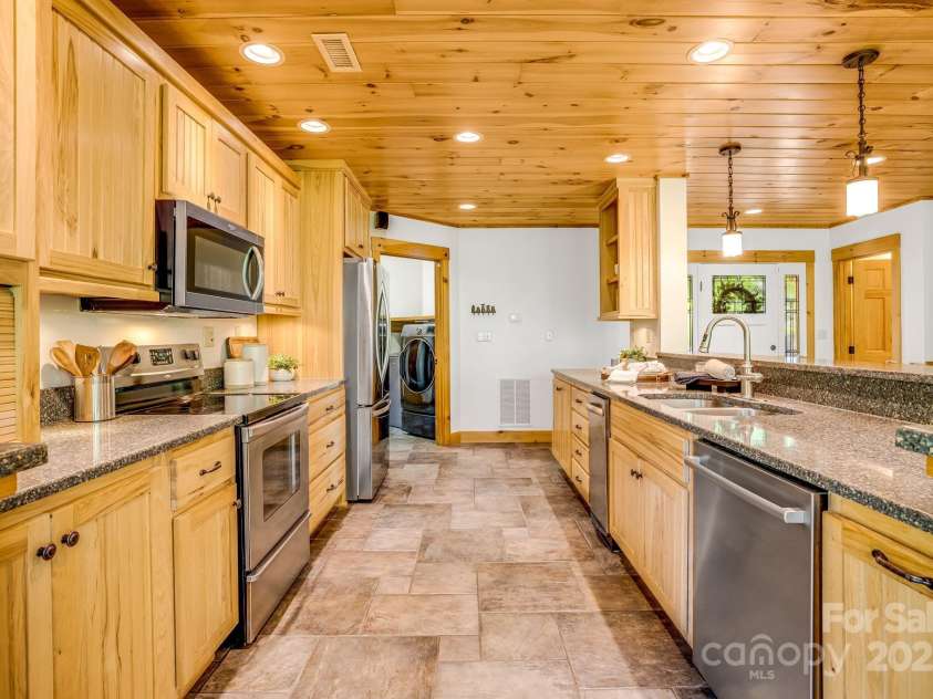 216 Log Gap Road, Fairview, NC 28730.  MLS# CAR4221522, YatesRealty ID 18479. Stainless Steel Appliances, Plentiful Storage