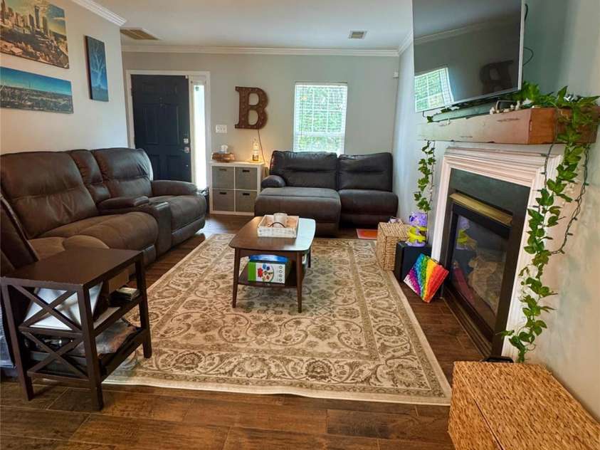 15003 Jerpoint Abby Drive, Charlotte, NC 28273.  MLS# CAR4247292, YatesRealty ID 18483. Family Room view from dining room