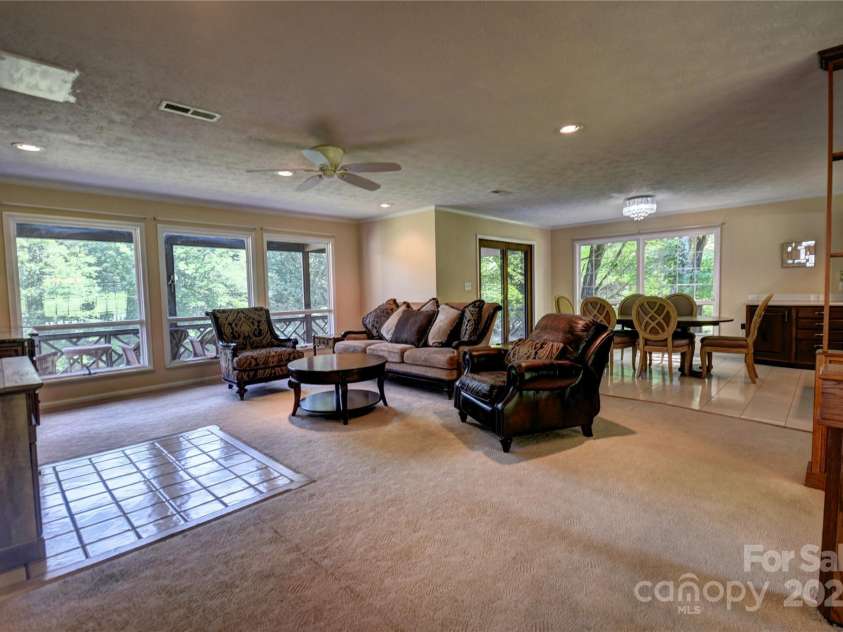 41 Balsam Shadows Road, Maggie Valley, NC 28751.  MLS# CAR4266877, YatesRealty ID 18489. Great Room from the top of the stairs