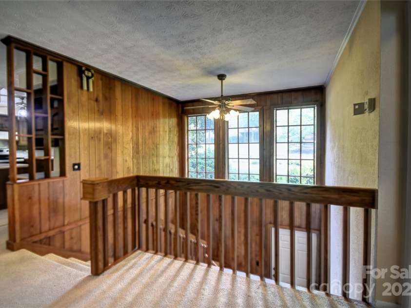 41 Balsam Shadows Road, Maggie Valley, NC 28751.  MLS# CAR4266877, YatesRealty ID 18489. Great Room looking back at the top of the stairs