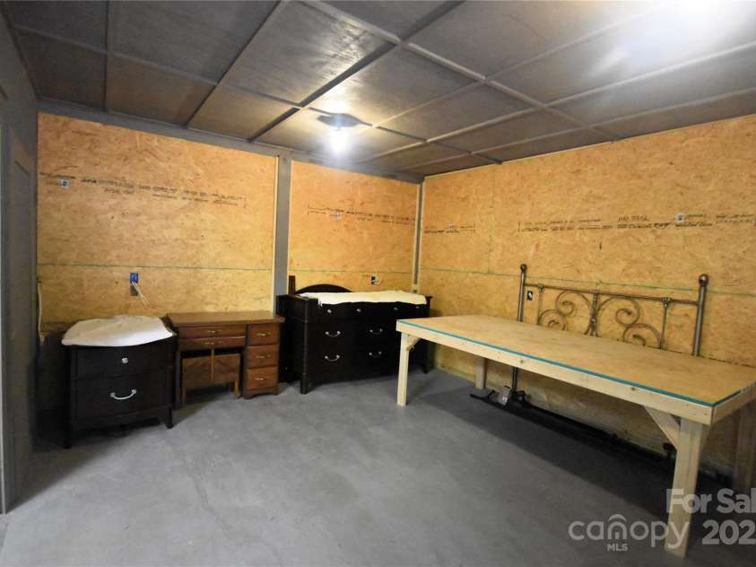 41 Balsam Shadows Road, Maggie Valley, NC 28751.  MLS# CAR4266877, YatesRealty ID 18489. Inside the workshop, room 1