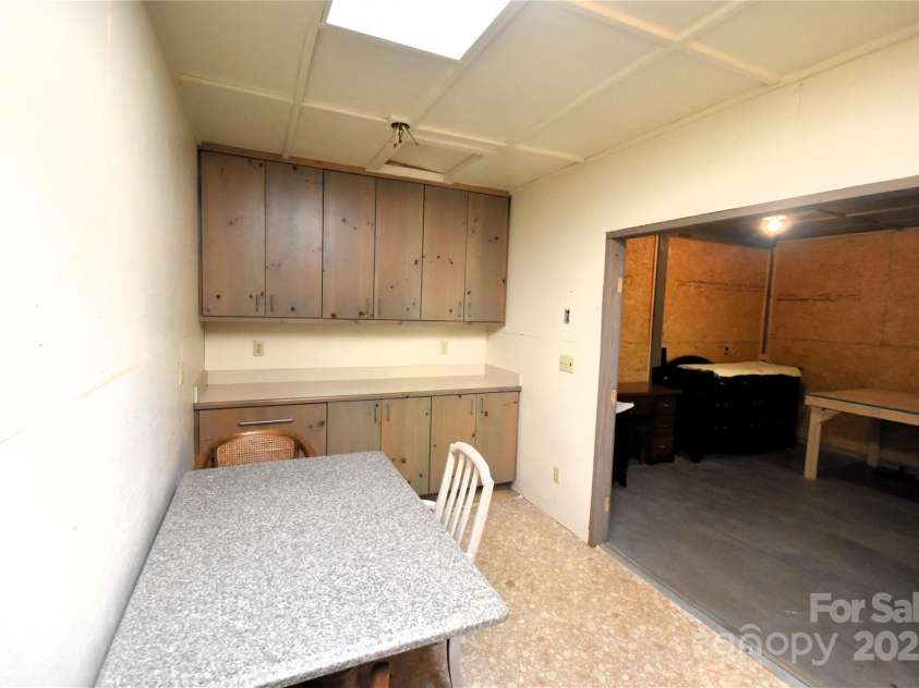 41 Balsam Shadows Road, Maggie Valley, NC 28751.  MLS# CAR4266877, YatesRealty ID 18489. Inside the workshop, room 2