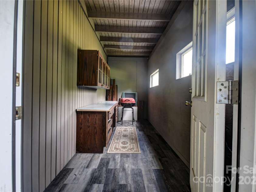 41 Balsam Shadows Road, Maggie Valley, NC 28751.  MLS# CAR4266877, YatesRealty ID 18489. Storage area, lower level, under the screened porch above