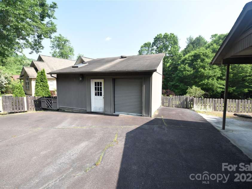 41 Balsam Shadows Road, Maggie Valley, NC 28751.  MLS# CAR4266877, YatesRealty ID 18489. Workshop/storage building at the end of the driveway