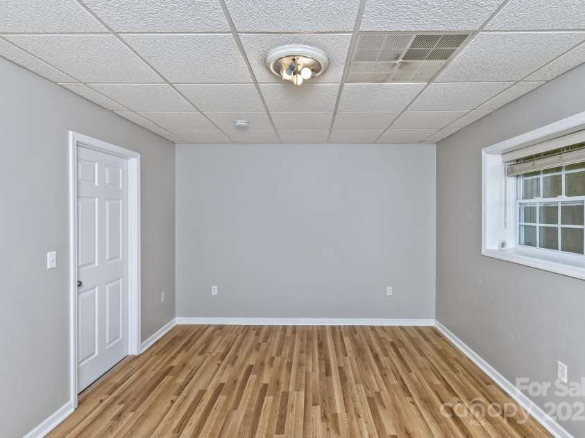 689 New Haw Creek Road, Asheville, NC 28805.  MLS# CAR4251121, YatesRealty ID 18491. 4th bedroom - lower level with access to back porch