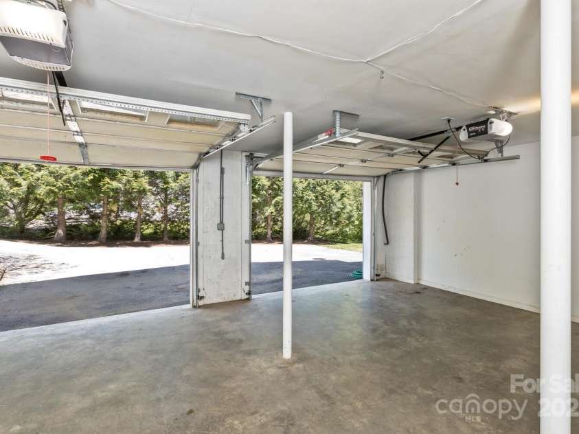 689 New Haw Creek Road, Asheville, NC 28805.  MLS# CAR4251121, YatesRealty ID 18491. Spacious 2 car garage with workspace