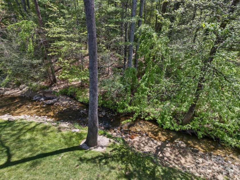 689 New Haw Creek Road, Asheville, NC 28805.  MLS# CAR4251121, YatesRealty ID 18491. View from the back porch - Haw Creek
