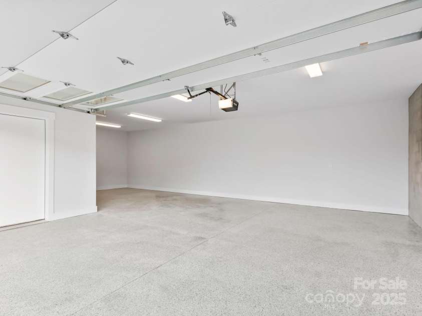 43 Reta Road, Fairview, NC 28730.  MLS# CAR4198071, YatesRealty ID 1850. Garage with epoxied floor