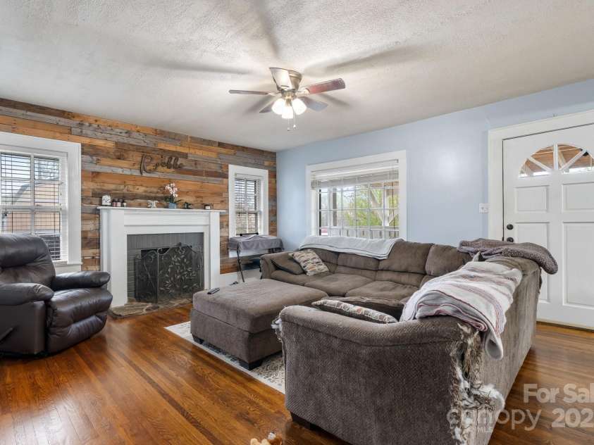 591 Oak Street, Marion, NC 28752.  MLS# CAR4253110, YatesRealty ID 18506. Great Living Room with Reclaimed Wood Wall.