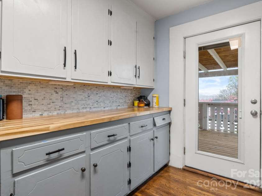 591 Oak Street, Marion, NC 28752.  MLS# CAR4253110, YatesRealty ID 18506. Kitchen View 3. Exterior Door Lets Natural Light into Kitchen.