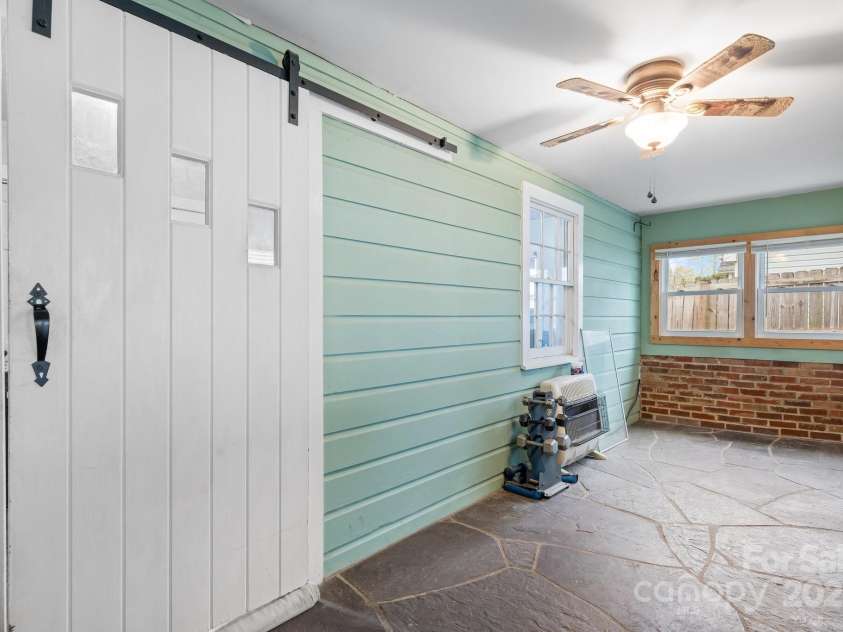 591 Oak Street, Marion, NC 28752.  MLS# CAR4253110, YatesRealty ID 18506. Sliding Barn Door into Office.