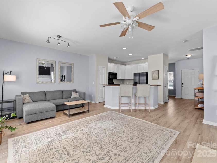2259 Crosscut Drive, Charlotte, NC 28214.  MLS# CAR4234585, YatesRealty ID 18508. Living Room with Fireplace and Kitchen