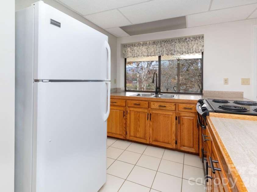 84 Joe jenkins Road, Fairview, NC 28730.  MLS# CAR4320581, YatesRealty ID 18509. Downstairs Kitchen