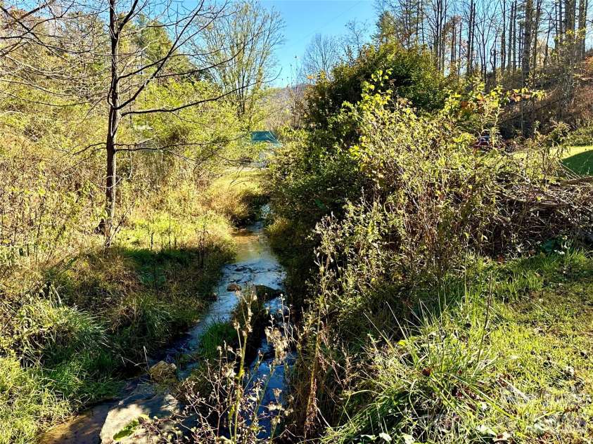 208 Murdock Road, Bakersville, NC 28705.  MLS# CAR4315892, YatesRealty ID 18510. Creek 