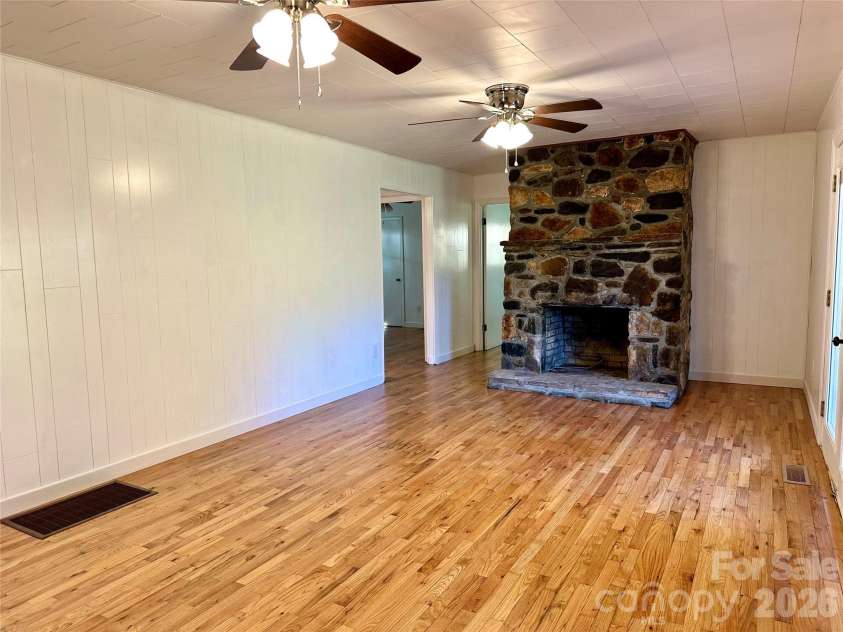 208 Murdock Road, Bakersville, NC 28705.  MLS# CAR4315892, YatesRealty ID 18510. Living Room view toward Fireplace