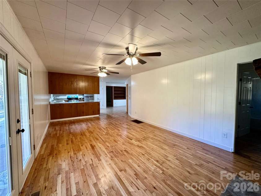 208 Murdock Road, Bakersville, NC 28705.  MLS# CAR4315892, YatesRealty ID 18510. Living Room view toward Kitchen