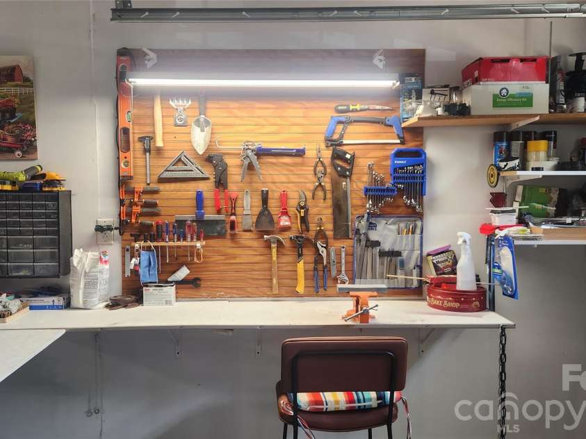1805 Crabapple Tree Lane, Charlotte, NC 28214.  MLS# CAR4293333, YatesRealty ID 18513. A work bench with foldable extension