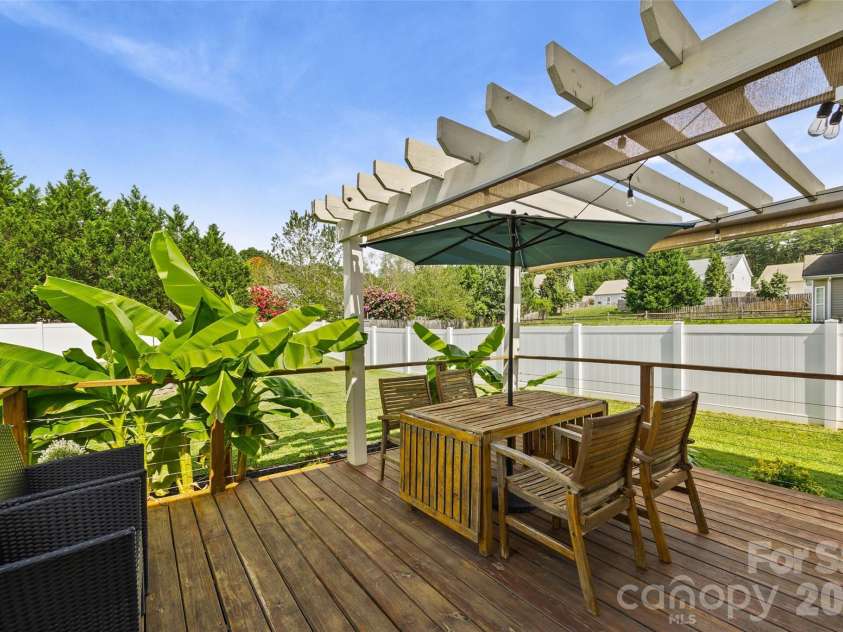 1805 Crabapple Tree Lane, Charlotte, NC 28214.  MLS# CAR4293333, YatesRealty ID 18513. Inviting deck with pergola
