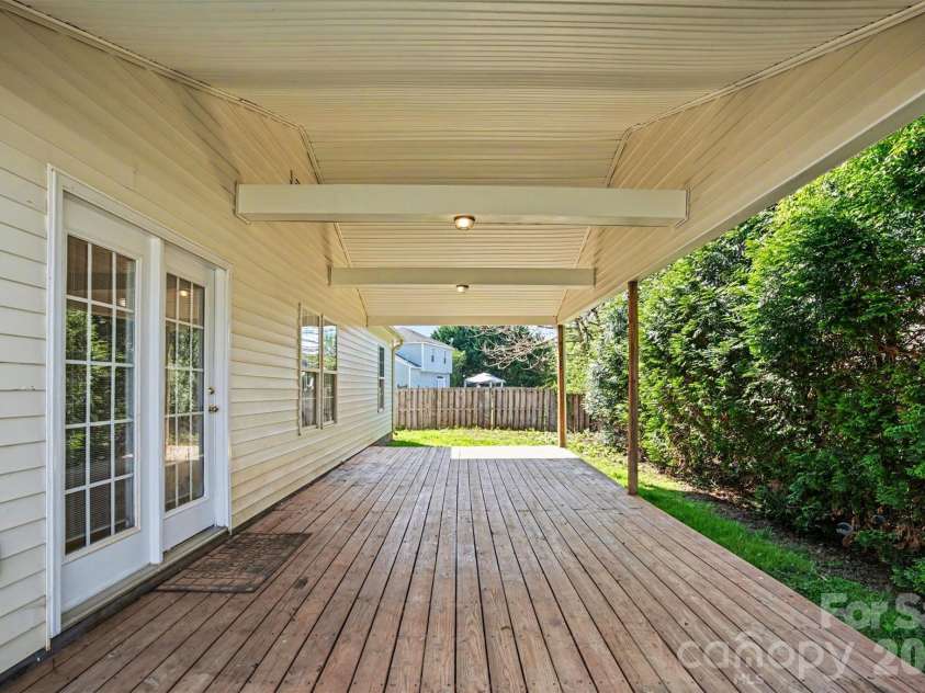 125 Sawhorse Drive, Mooresville, NC 28115.  MLS# CAR4369659, YatesRealty ID 18514. Back Covered Deck