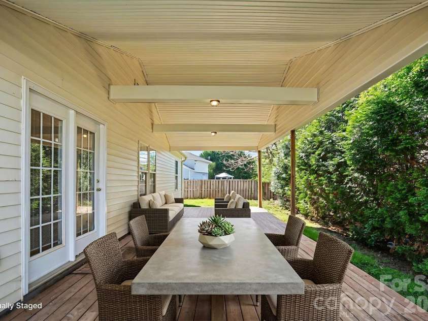 125 Sawhorse Drive, Mooresville, NC 28115.  MLS# CAR4369659, YatesRealty ID 18514. Back Covered Deck Virtually Staged