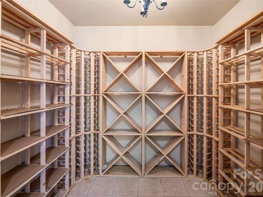 7 Cooper Cove, Hendersonville, NC 28739.  MLS# CAR4371497, YatesRealty ID 18519. Wine room