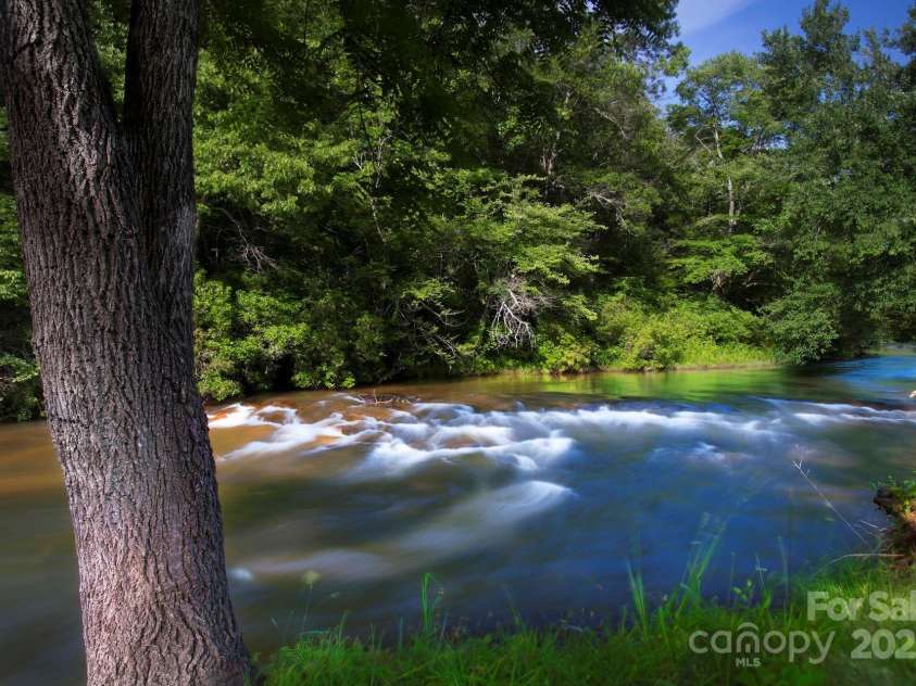 49 Sundrops Trail, Cullowhee, NC 28723.  MLS# CAR4266552, YatesRealty ID 18521. Caney Fork Creek