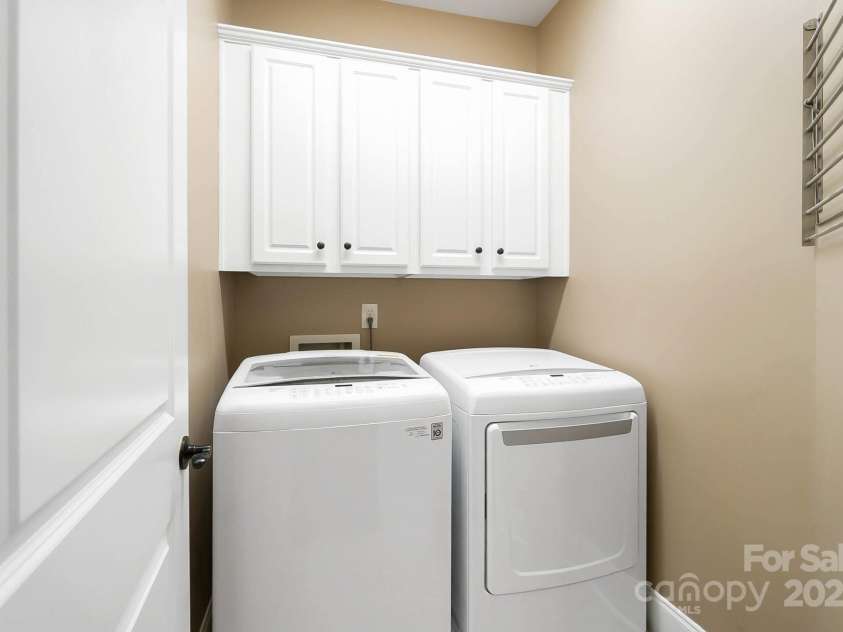 9735 Wheatfield Road, Charlotte, NC 28277.  MLS# CAR4253750, YatesRealty ID 18527. 2nd floor full laundry room