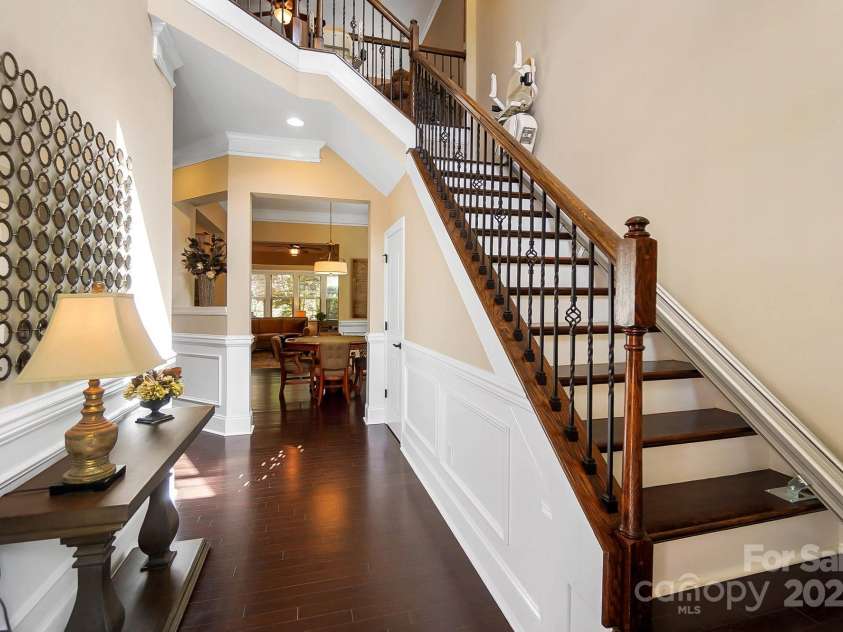 9735 Wheatfield Road, Charlotte, NC 28277.  MLS# CAR4253750, YatesRealty ID 18527. Entry way with hardwood flooring, craftsman style chair rail, and crown moldings