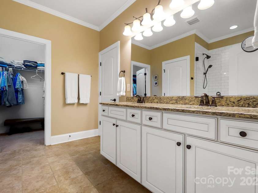 9735 Wheatfield Road, Charlotte, NC 28277.  MLS# CAR4253750, YatesRealty ID 18527. Primary suite full bath with dual vanity