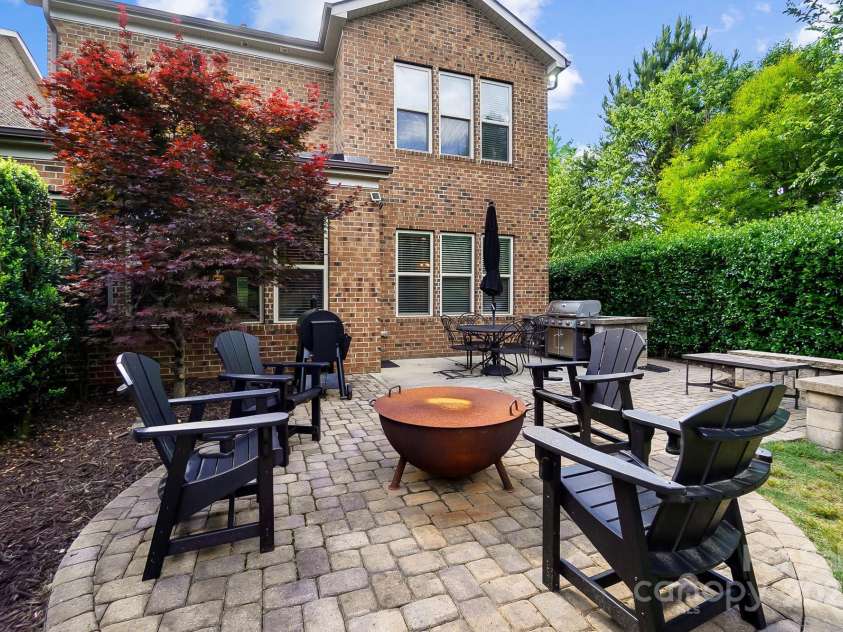 9735 Wheatfield Road, Charlotte, NC 28277.  MLS# CAR4253750, YatesRealty ID 18527. Rear yard custom patio with fire pit area and custom grill area