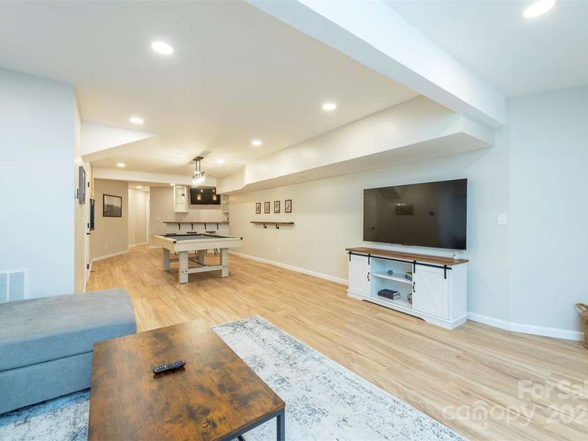 56 Great Horned Owl Road, Candler, NC 28715.  MLS# CAR4255204, YatesRealty ID 18529. Lower Level Flex Space