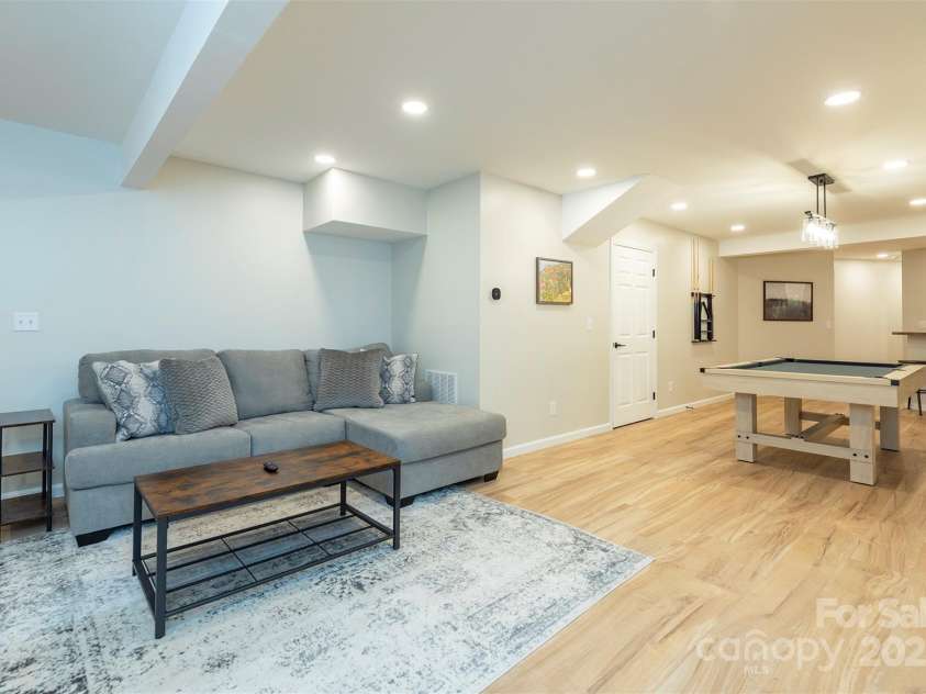 56 Great Horned Owl Road, Candler, NC 28715.  MLS# CAR4255204, YatesRealty ID 18529. Lower Level Flex Space