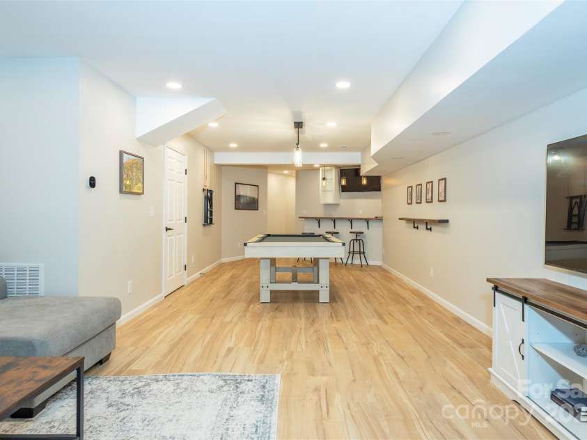 56 Great Horned Owl Road, Candler, NC 28715.  MLS# CAR4255204, YatesRealty ID 18529. Lower Level Flex Space w/Wet Bar!