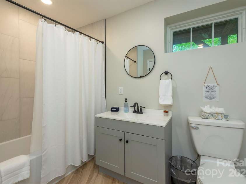 56 Great Horned Owl Road, Candler, NC 28715.  MLS# CAR4255204, YatesRealty ID 18529. Lower Level Full Bathroom
