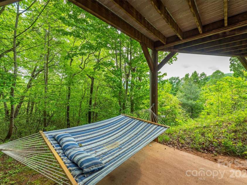 56 Great Horned Owl Road, Candler, NC 28715.  MLS# CAR4255204, YatesRealty ID 18529. Lower Level Private Patio