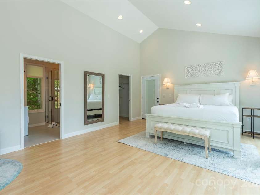 56 Great Horned Owl Road, Candler, NC 28715.  MLS# CAR4255204, YatesRealty ID 18529. Main Floor Suite #2: Far door leads to the screen porch!