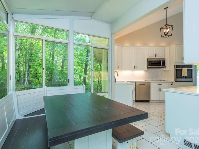 56 Great Horned Owl Road, Candler, NC 28715.  MLS# CAR4255204, YatesRealty ID 18529. Sun room