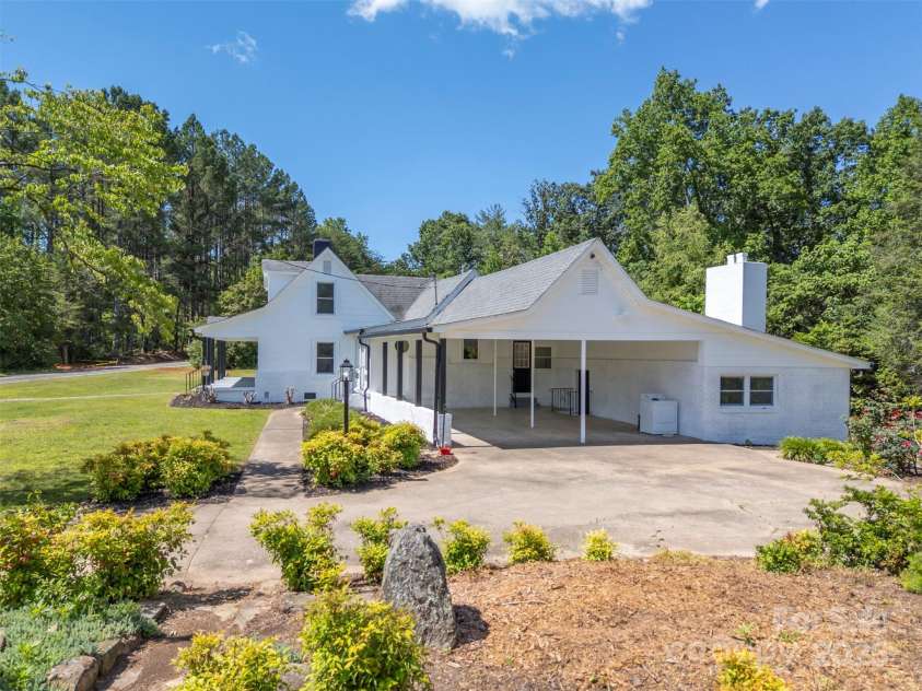983 Stroud Road, Ellenboro, NC 28040.  MLS# CAR4263723, YatesRealty ID 18532. Carport w/mudroom & entrance to guest quarters