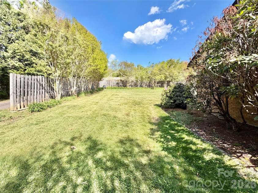 15 Pinedale Road, Asheville, NC 28805.  MLS# CAR4374153, YatesRealty ID 18534. Side yard