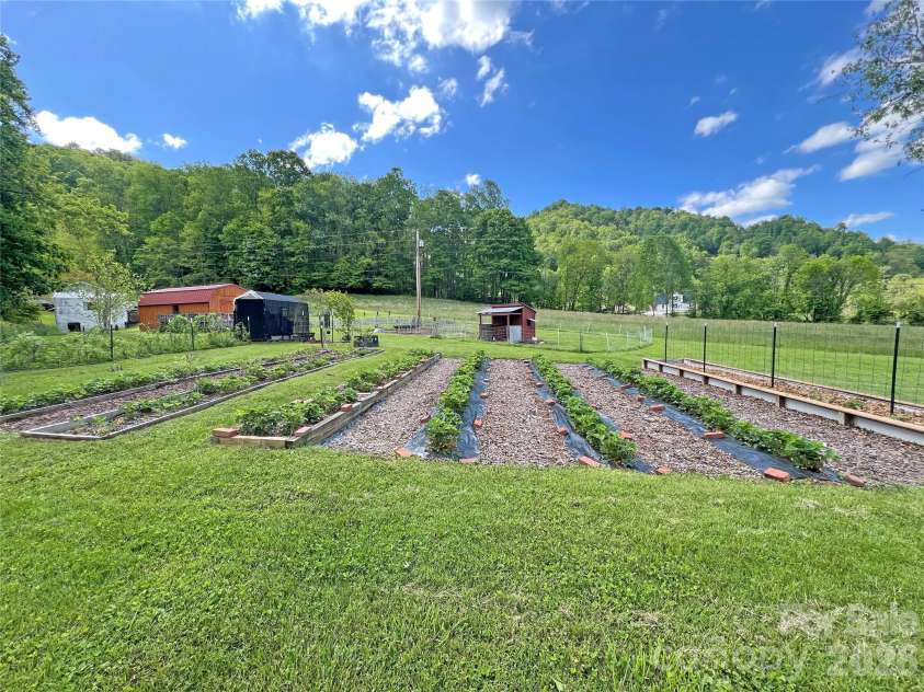 550 Joe Payne Road, Marshall, NC 28753.  MLS# CAR4257370, YatesRealty ID 18535. Gardens!