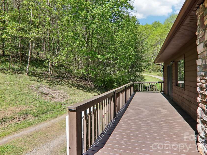 129 Cash Phillips Drive, Mars Hill, NC 28754.  MLS# CAR4371101, YatesRealty ID 18538. Deck Off Primary Bedroom