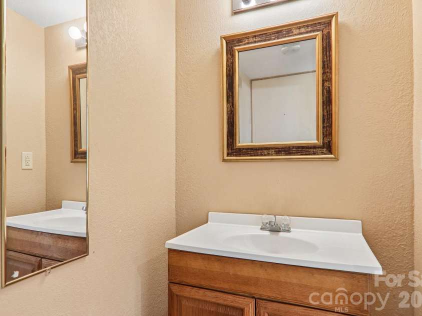 129 Cash Phillips Drive, Mars Hill, NC 28754.  MLS# CAR4371101, YatesRealty ID 18538. Powder Room Lower Level