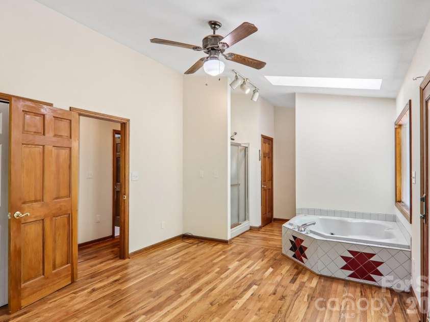 129 Cash Phillips Drive, Mars Hill, NC 28754.  MLS# CAR4371101, YatesRealty ID 18538. Primary Bedroom Main Level w/skylight