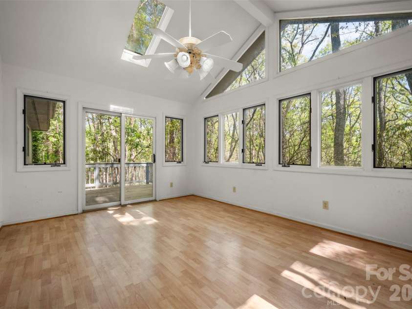 176 Fox Run Lane, Tryon, NC 28782.  MLS# CAR4359459, YatesRealty ID 18539. Art studio behind garage with separate entrance/deck