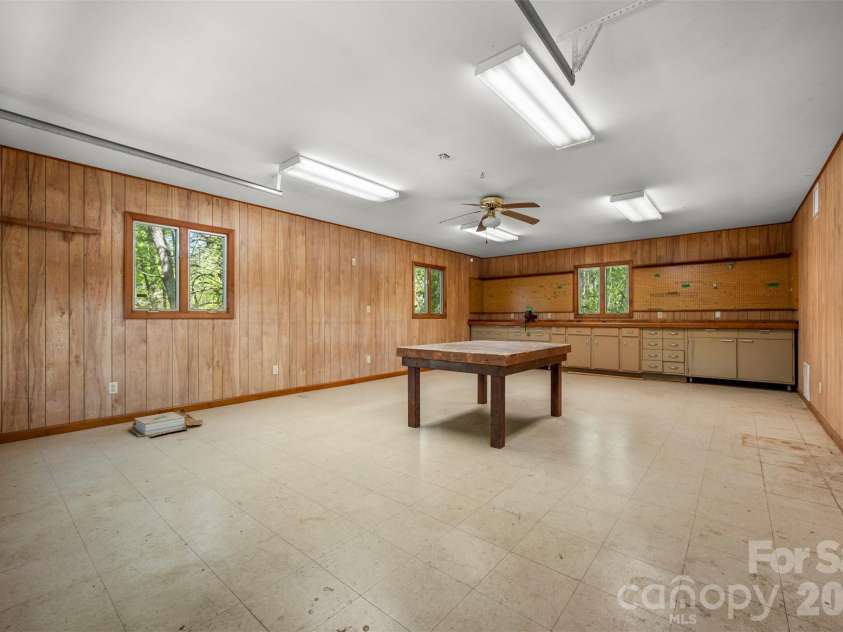 176 Fox Run Lane, Tryon, NC 28782.  MLS# CAR4359459, YatesRealty ID 18539. Garage workshop