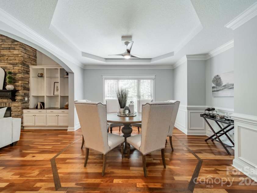 165 Blue Ridge Trail, Mooresville, NC 28117.  MLS# CAR4225294, YatesRealty ID 18540. Dining room with Tray ceilings and wainscot.